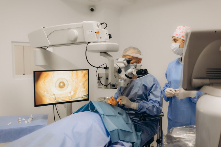 Skilled surgeon and his medical team performs precise eye surgery on an elderly patient, restoring